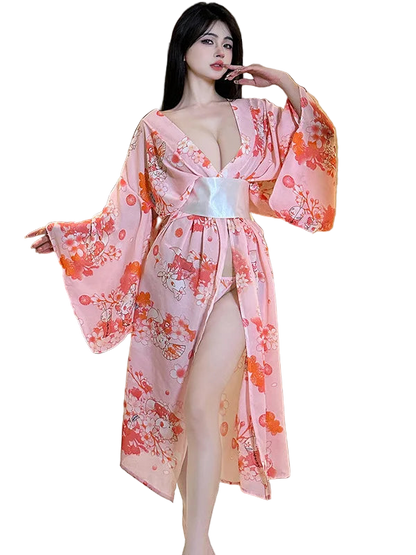 Woman wearing a pink floral kimono in an indoor setting