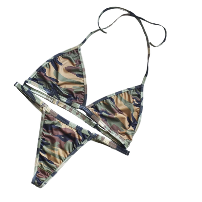 A two-piece camouflage print string bikini set, featuring a triangle halter top and matching low-rise string bottoms, laid flat on a white background.
