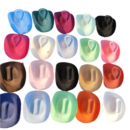 Colorful cowboy hats arranged in a grid on grass