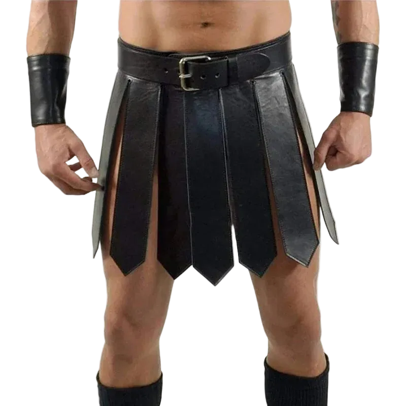 A black faux-leather gladiator-style kilt costume accessory with a matching belt, worn by a model. The kilt features multiple vertical panels with cutouts, paired with matching black wrist cuffs and leg warmers, shown against a plain white background.