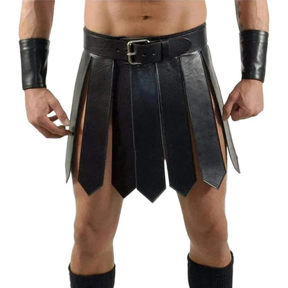 A black faux-leather gladiator-style kilt costume accessory with a matching belt, worn by a model. The kilt features multiple vertical panels with cutouts, paired with matching black wrist cuffs and leg warmers, shown against a plain white background.