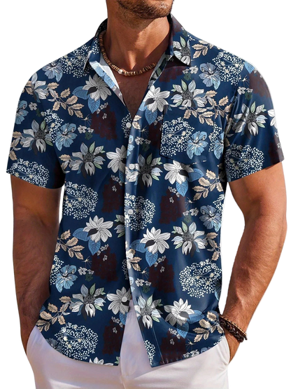 Man wearing a blue floral short-sleeve shirt on a white background