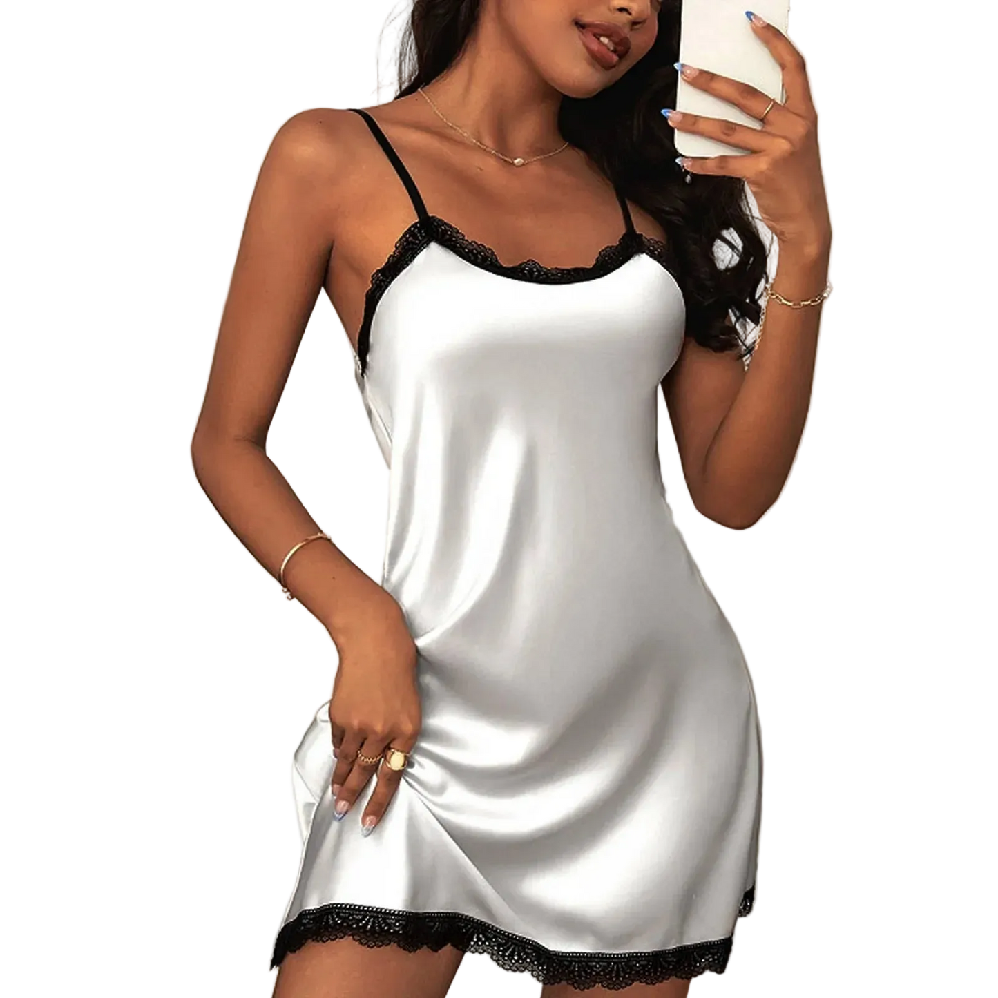 Woman wearing a white satin nightgown with black lace trim, holding a phone.