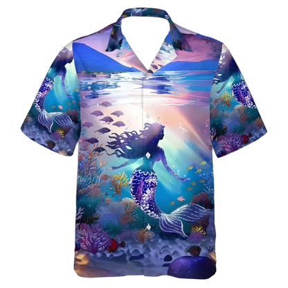 A short-sleeve button-up camp shirt featuring a vibrant mermaid and underwater reef print in shades of blue, purple, and pink, displayed on a clean white background.