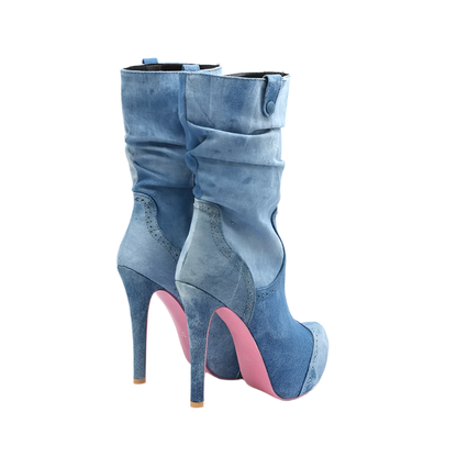 Blue denim high-heeled boots with pink soles on a white background