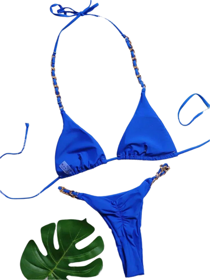 Blue Bikini with Gold Chain: A shiny blue bikini set embellished with gold chain straps, creating a luxurious and stylish appearance.

