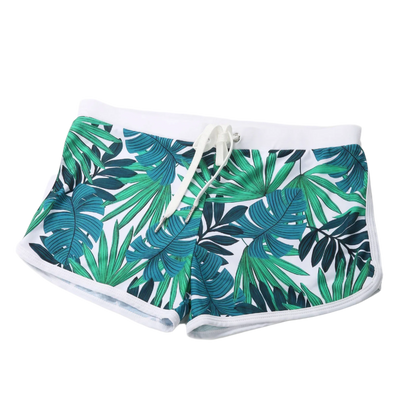 Blue and green leaf-patterned swim shorts with a white waistband.