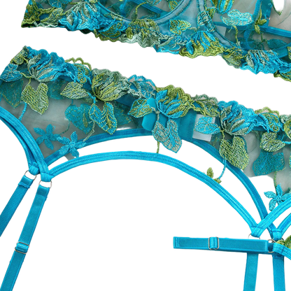 Blue lace corset with floral details on a white background