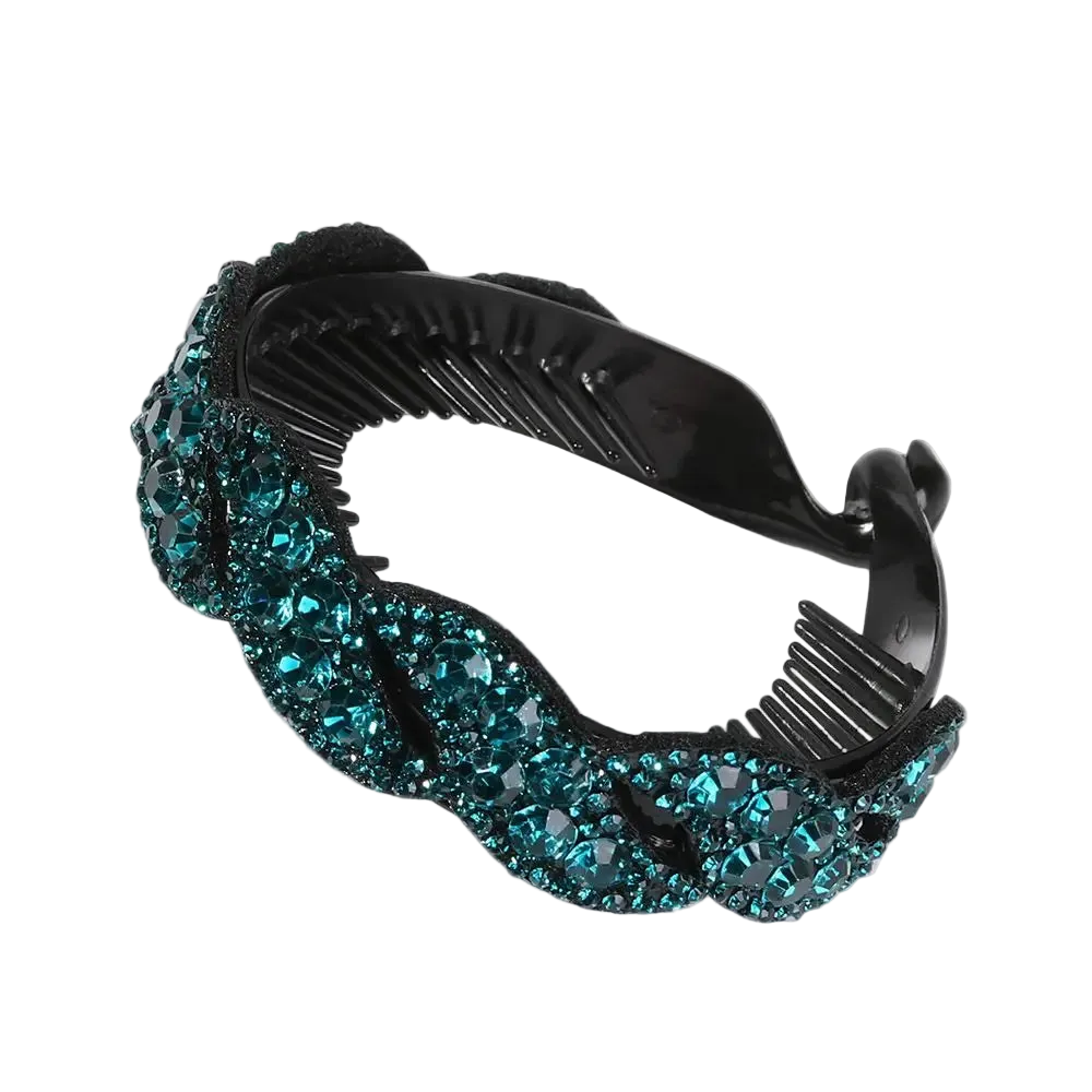 A black plastic hair comb embellished with a wavy border of sparkling teal blue rhinestones, shown on a plain white background.