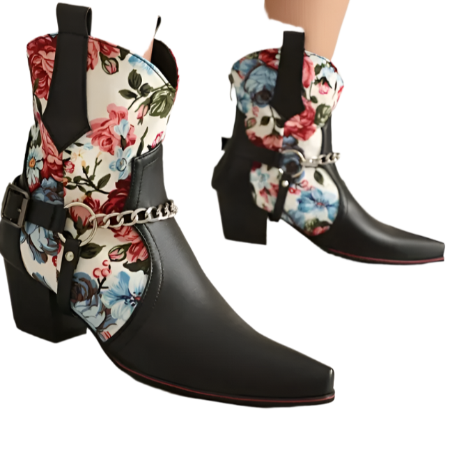 Black cowboy boots with floral patterns on a neutral background