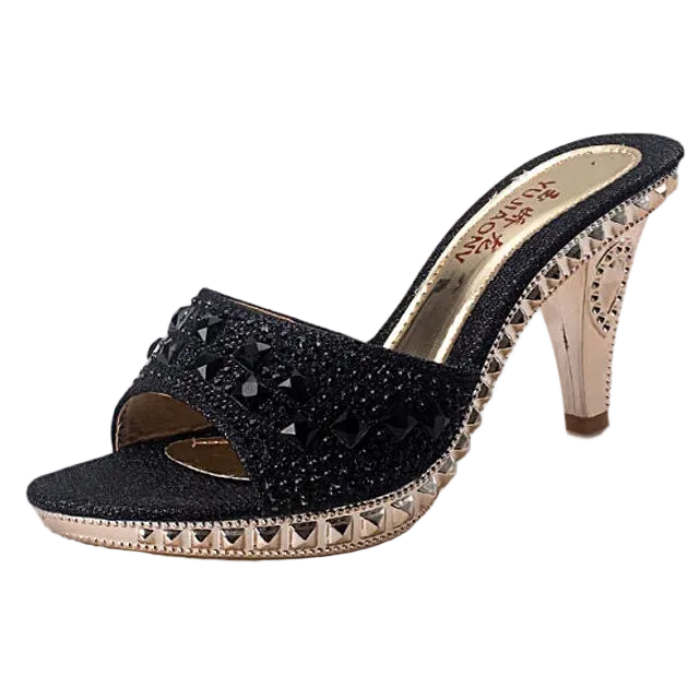 Black high-heeled shoe with studded details on a white background