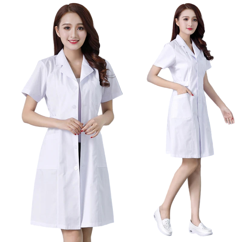 Woman wearing a white lab coat against a gray background