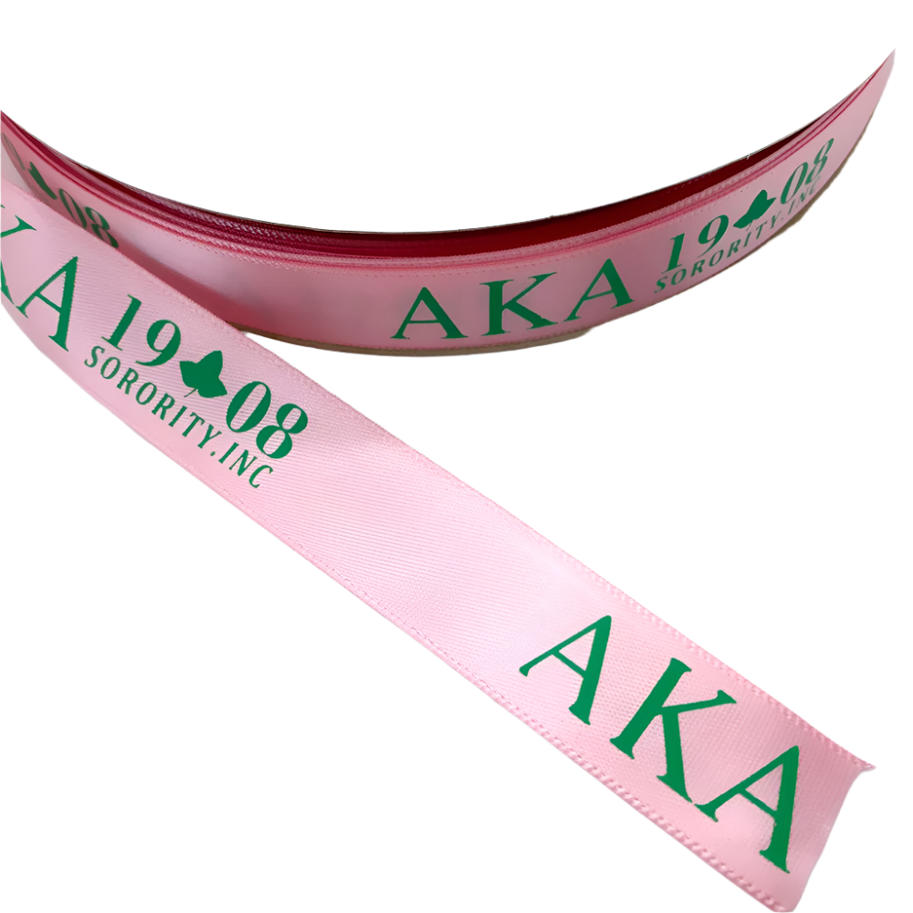Pink ribbon with green text 'AKA 1908 Sorority, Inc.' on a white background