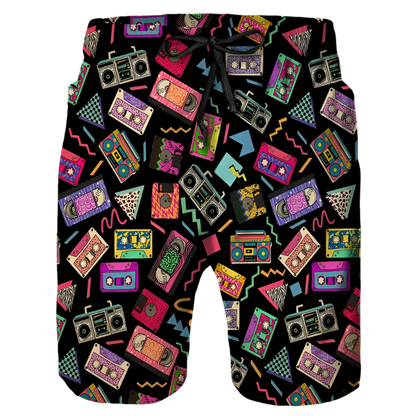 Retro Pattern Shorts: A pair of black shorts with a vibrant retro pattern featuring cassette tapes, boomboxes, and geometric shapes in various colors, adding a fun and nostalgic vibe.

