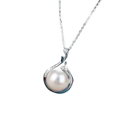 Pearl necklace with silver chain on a dark blue fabric background