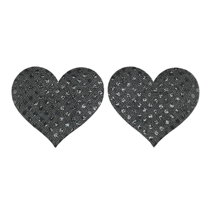 Two black heart-shaped pasties with a textured pattern on a white background