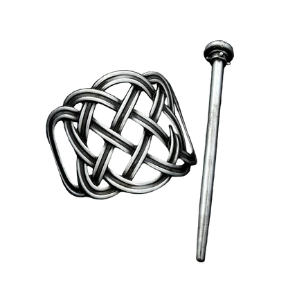 Silver knot-shaped brooch on a dark textured background