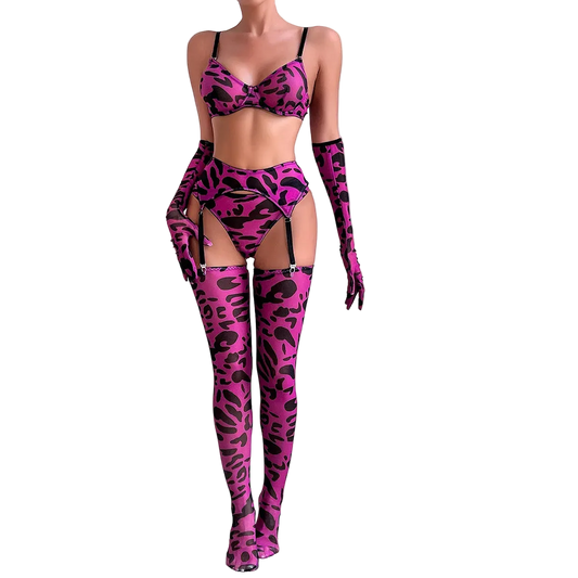 Person wearing a pink leopard print lingerie set with matching gloves and thigh-high boots on a white background.