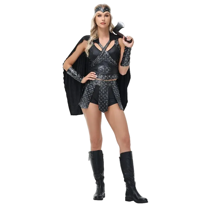 A woman modeling a black and silver warrior costume with a matching headband, arm cuffs, mini skirt, and black cape, holding a toy axe against a plain white background.