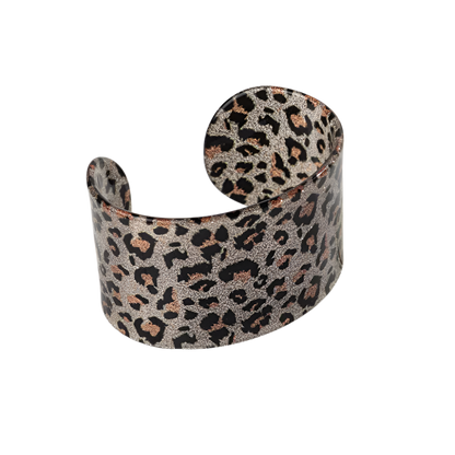 Bold leopard print wide cuff bangle featuring hollow geometric patterns and premium resin design for resort wear and theme nights

