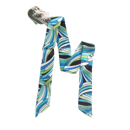 Colorful patterned scarf on a white surface