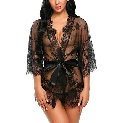 Black lace lingerie with a bow on a white background