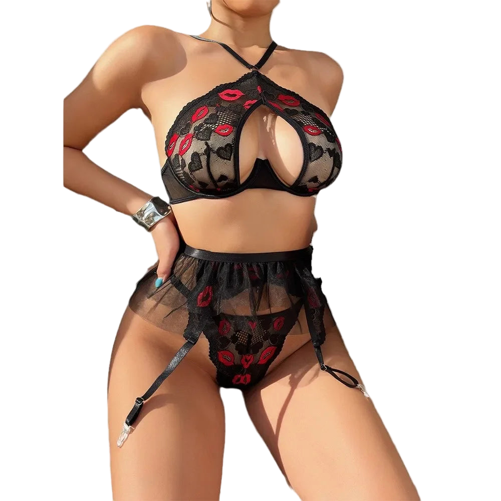 Black lace lingerie set with red accents on a white background