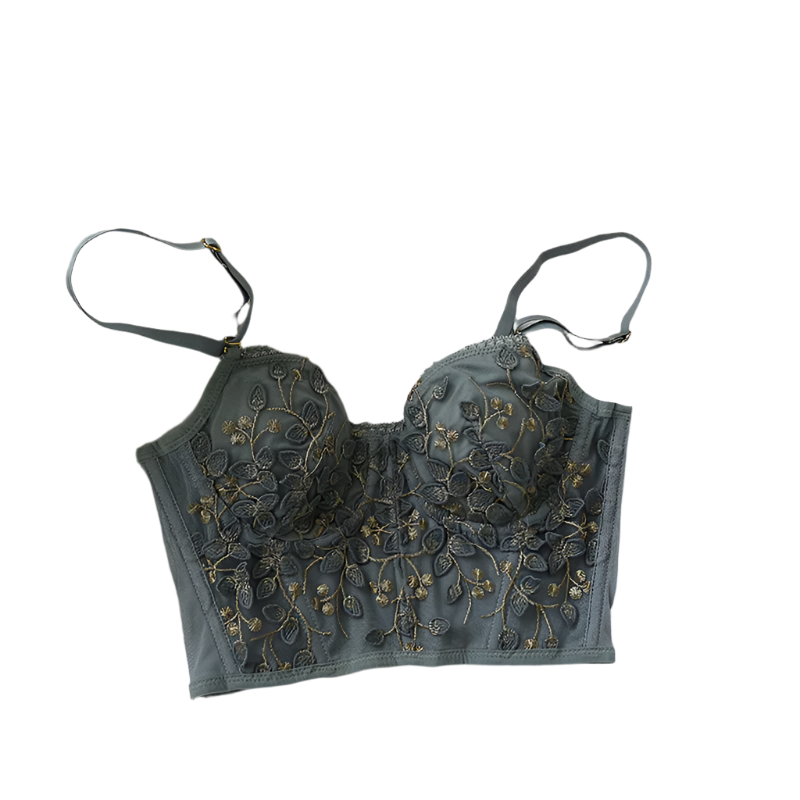 Embroidered bralette on a white bedspread