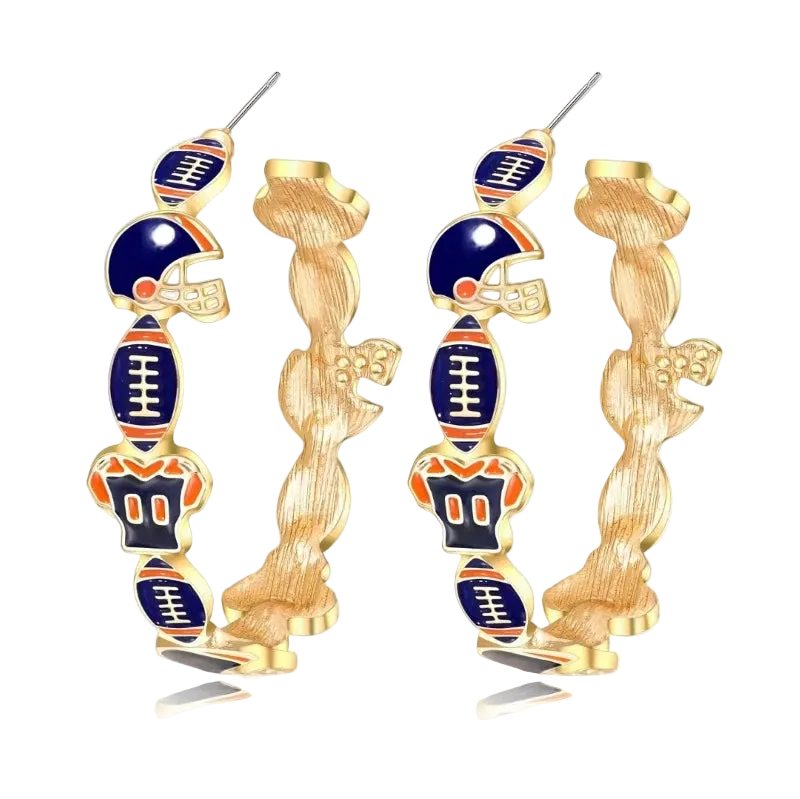 A pair of gold hoop earrings featuring stacked football-themed charms, including helmets, footballs, and a large football at the bottom, with navy blue and orange enamel details, shown on a white background with a soft reflection.