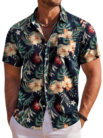 Man wearing a tropical floral shirt with a white background
