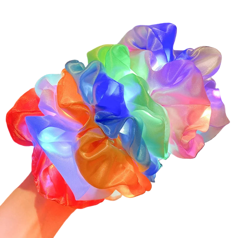 Colorful LED scrunchies on a blurred indoor background