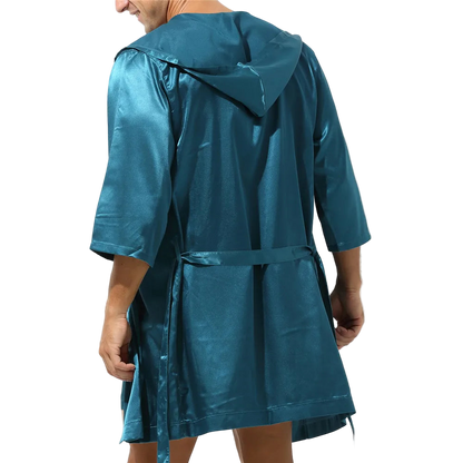 Teal raincoat worn by a person on a white background