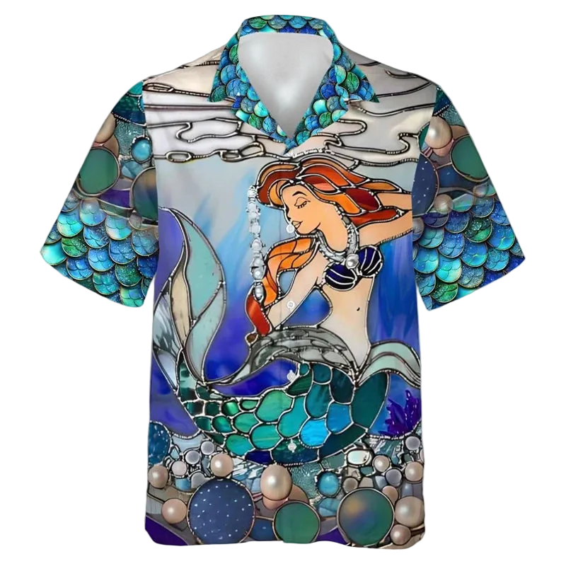 A short-sleeve button-up camp collar shirt featuring a colorful stained-glass style illustration of a mermaid with orange hair and a teal tail, set against an underwater scene with pearls and blue water.