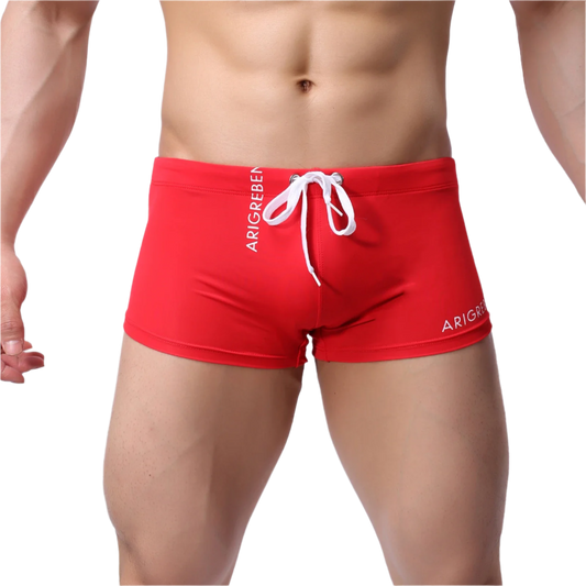 Red swim trunks with white drawstring and 'ARIGREBEN' branding