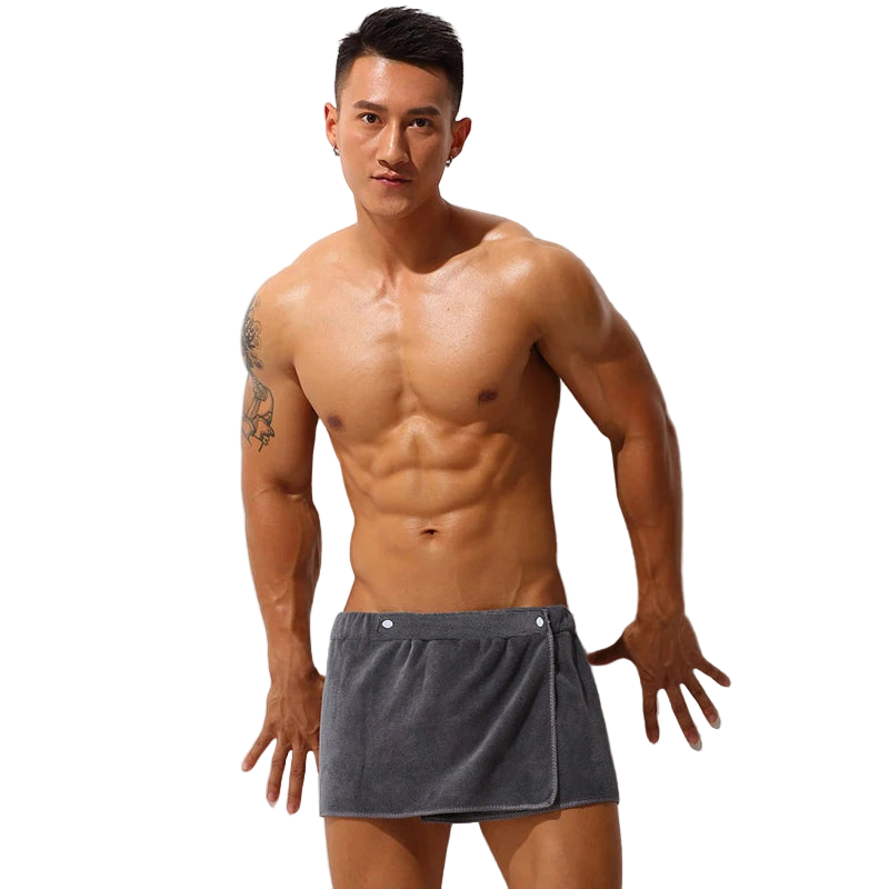 Man wearing gray swim shorts against a white background with color swatches.