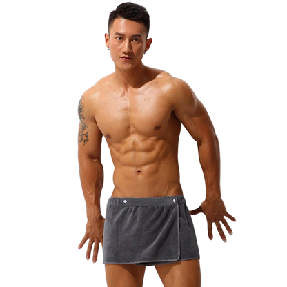 Man wearing gray swim shorts against a white background with color swatches.