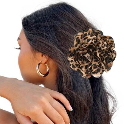 Seductive leopard print hair claw with bold flower accent, designed for intimate occasions and romantic styling I notice you're expanding your sensual accessories line. This aligns well with your other intimate products like the leopard nipple covers and LED lingerie sets, creating a cohesive collection for intimate occasions.