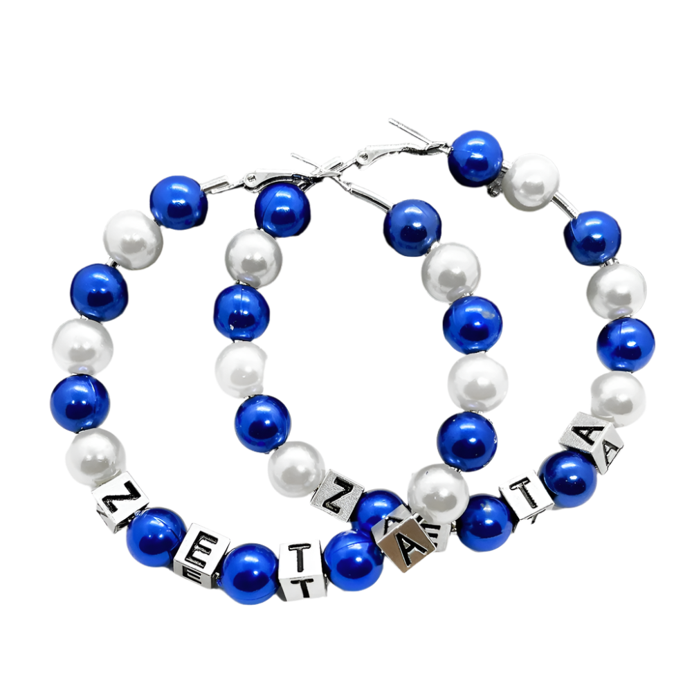 Pair of blue and white beaded bracelets with lettered ends on a black leather surface.