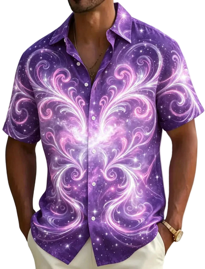 A man wearing a short-sleeve button-up shirt with a vibrant purple and pink galaxy swirl pattern, set against a blurred beach background with palm trees.