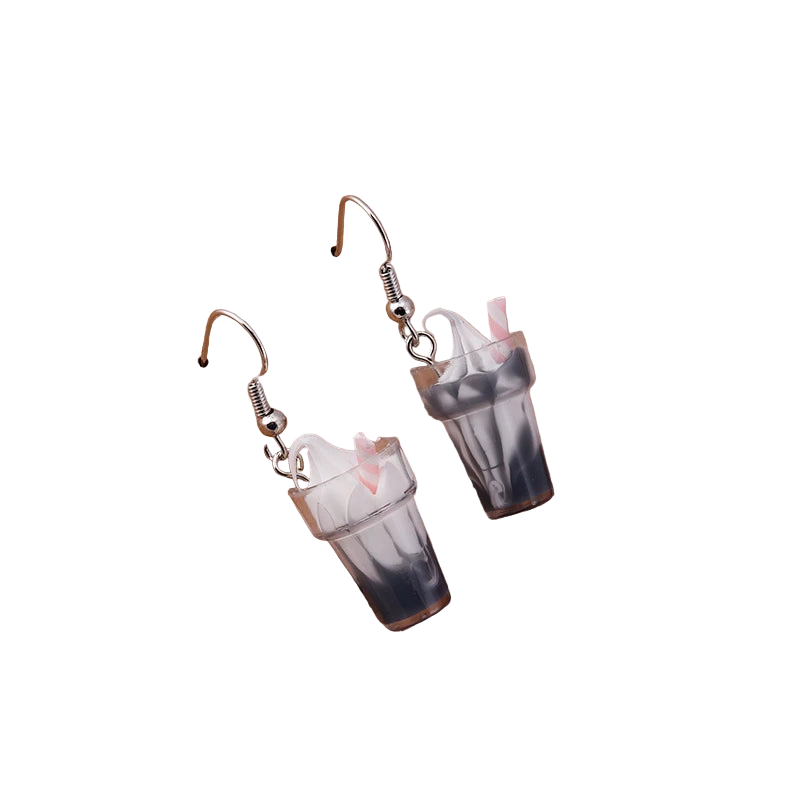 Dangle earrings resembling milkshakes on a wooden stand with 'Love Jewels' engraving.