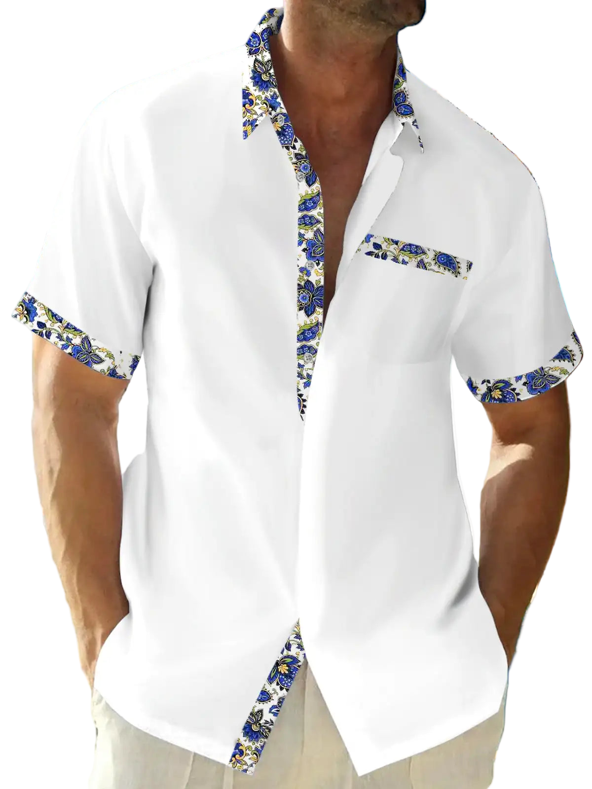 Man wearing a white shirt with floral trim on a beach