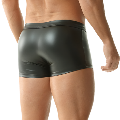 Person wearing shiny black underwear on a white background