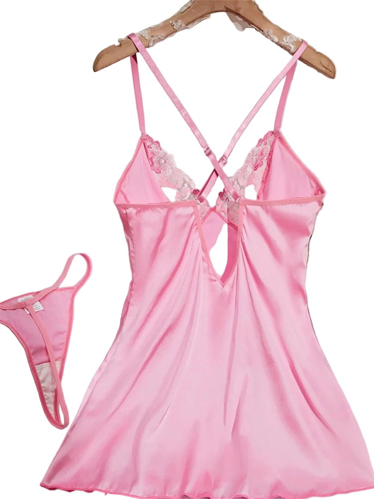 Pink satin nightgown with lace details on a hanger against a white background.