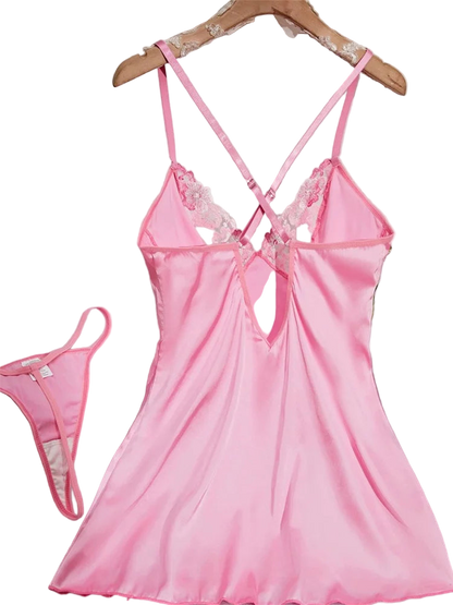 Pink satin nightgown with lace details on a hanger against a white background.