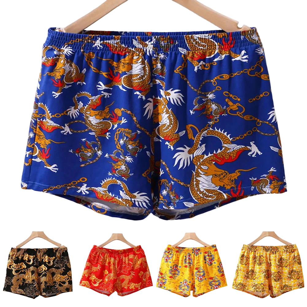 Colorful dragon-patterned boxer shorts on hangers with a white background