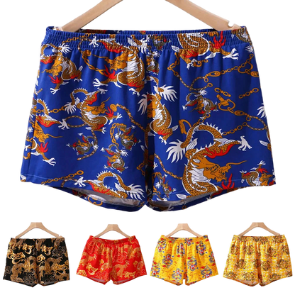 Colorful dragon-patterned boxer shorts on hangers with a white background