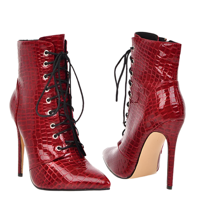 Red high-heeled lace-up boots with crocodile texture on a white background