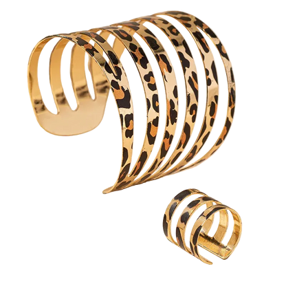 Set of gold and leopard print bangles on a beige background