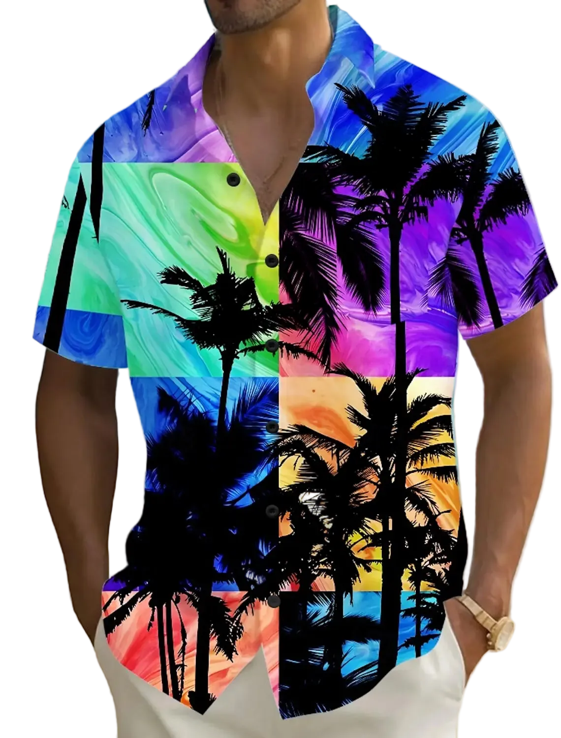 Person wearing a colorful shirt with palm tree design on a beach