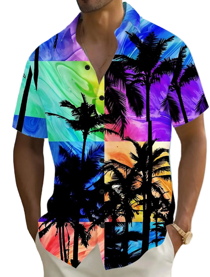 Person wearing a colorful shirt with palm tree design on a beach